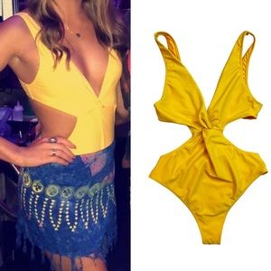 Yellow twist front high cut one open back piece swimsuit.